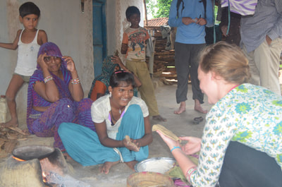 Student learns to make 'roti' (an Indian Bread) in the home of a local family