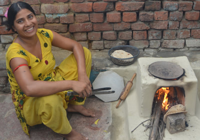 Local woman shows students to make 'roti' (Indian Bread)