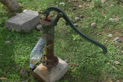 Crude water pipe with a plastic water bottle as the spout